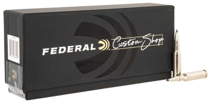 Box of Federal Custom Shop ammunition with two golden projectiles displayed, showcasing quality and performance.